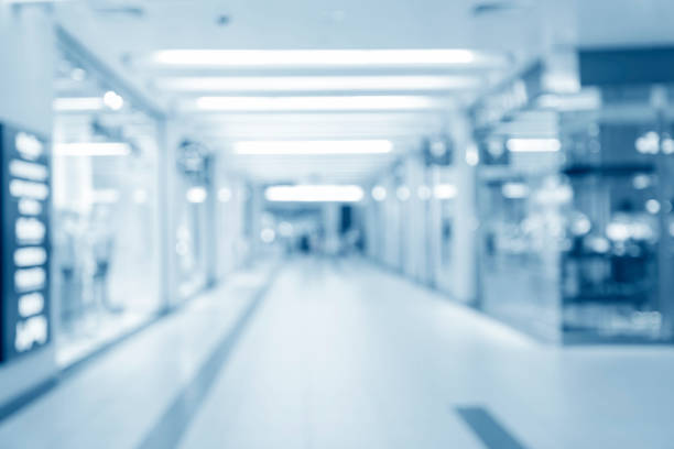 istock Abstract blurred interior of corridor clinic background in blue color , blurry image 1373274706