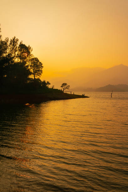istock Beautiful Sunset lake view with mountains 1373274909