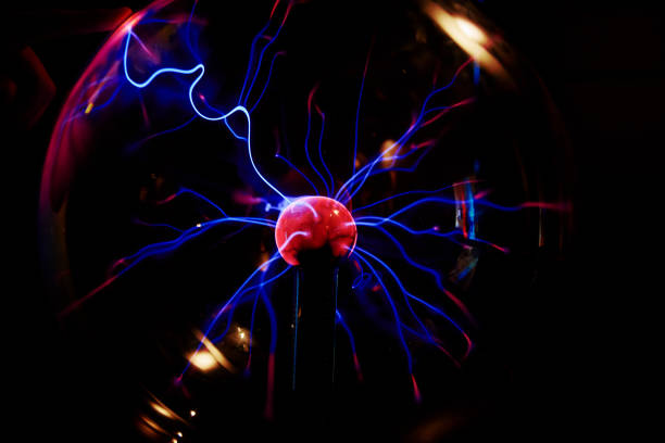 istock Plasma ball with energy rays on dark background 1373275538