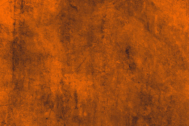 istock Dark orange color abstract grunge textured old cement plaster wall surface for background 1373276801