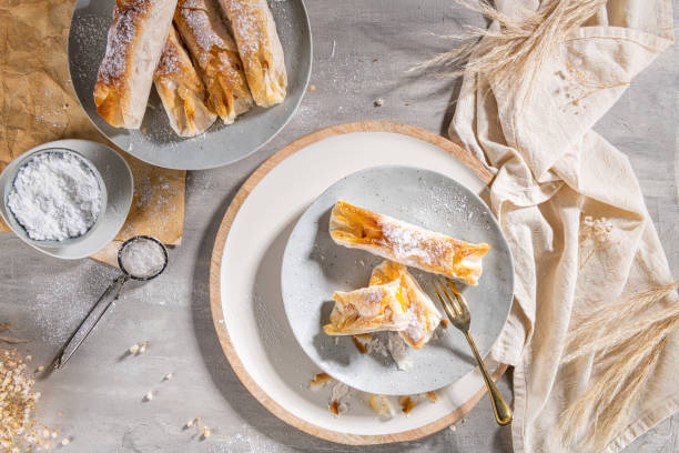 istock Typical portuguese sweets Pasteis de Vouzela served on countertop. Filo pastry with egg cream filling 1373280850