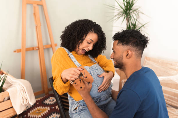 istock Excited young couple is about to get a baby while arranging new home 1373281154