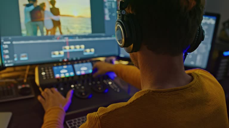 SLO MO Film editor edits a music video  in a professional video editing suite