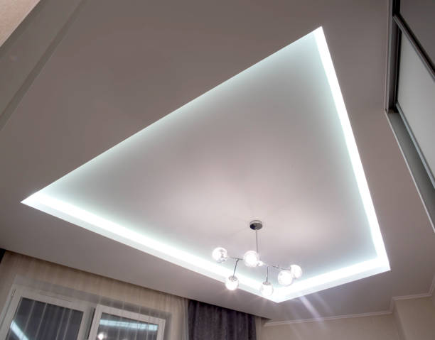 istock A beautiful stretch ceiling with diode lighting and an unusual chandelier with balls. Designer modern ceiling 1373282912