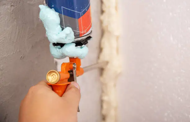 Construction foam gun with a defective cylinder. Foam bottle defect