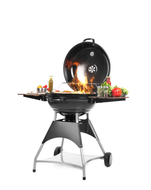 istock Flaming barbecue grill with cooking meal on white background 1373287615