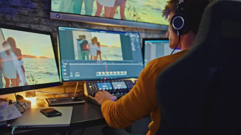DS Film editor uses professional video editing panel as he editing some footage
