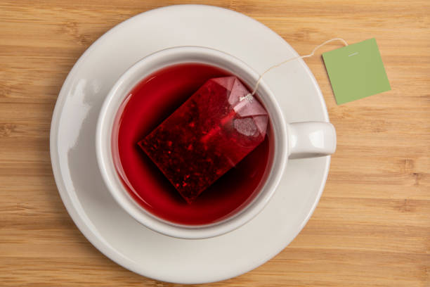 istock Hot Tea in Cup with on Wood Surface 1373289203