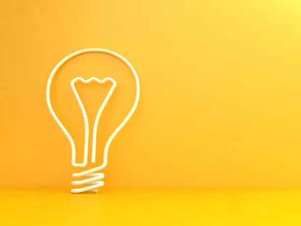 Light bulb shape on yellow background. Creativity and innovation concept.