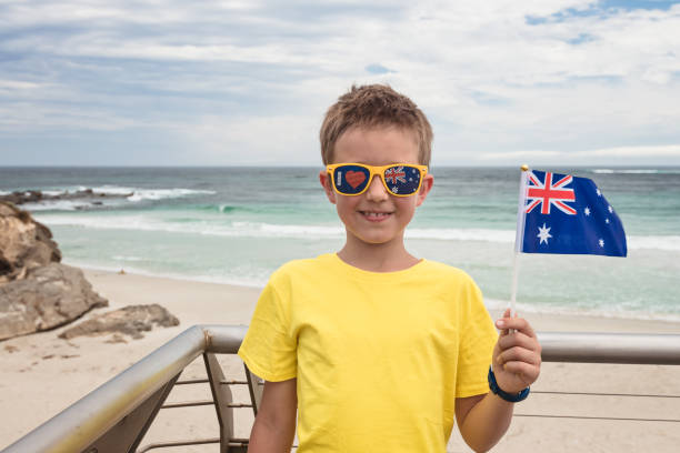 istock Boy holding Australian flag in his hand on Australia Day 1373291514