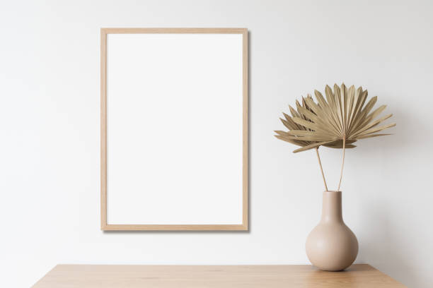 istock Artwork mock-up in interior design. Blank white vertical picture frame on a cupboard 1373291652