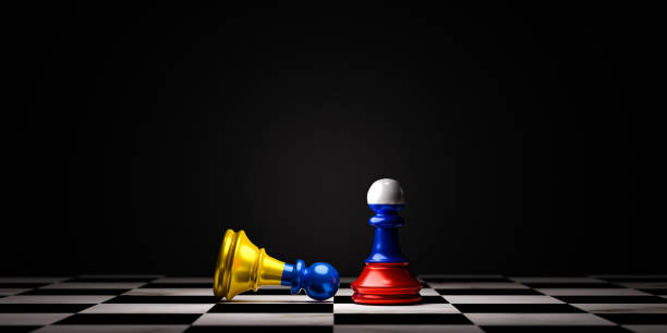 istock Ukraine flag fall and Russia flag standing on chess board forth countries political conflict and war concept by 3d rendering technique. 1373291849