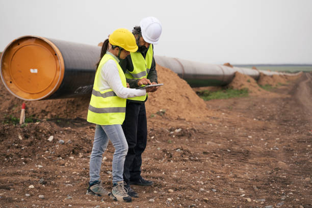 Engineers team working on South stream gas pipeline construction site. stock photo