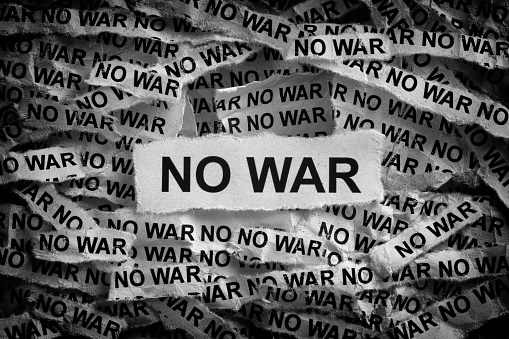 Strips of newspaper with the words No War