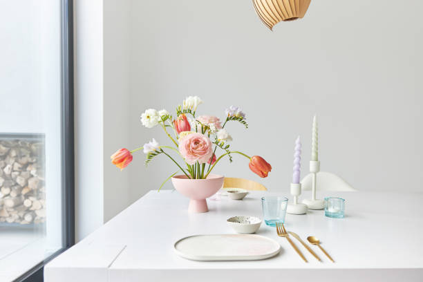a modern spring bouquet with freesias, ranunculus and tulips in a beautiful vase - arrangement flower head flower blossom imagens e fotografias de stock