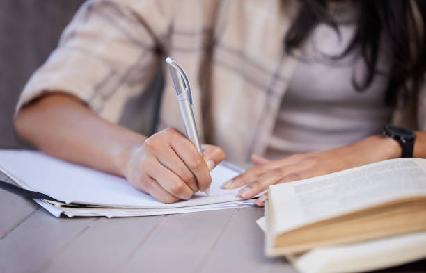 istock Shot of an unrecognizable student studying at home 1373298284