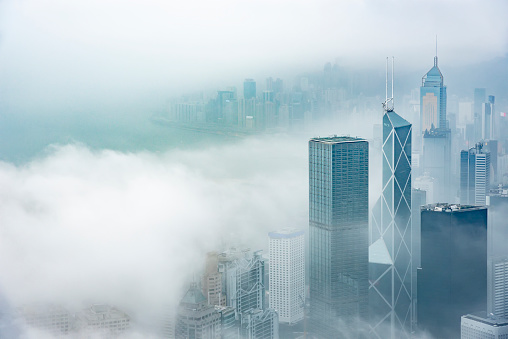 Skyscraper in downtown of Hong Kong city in fog