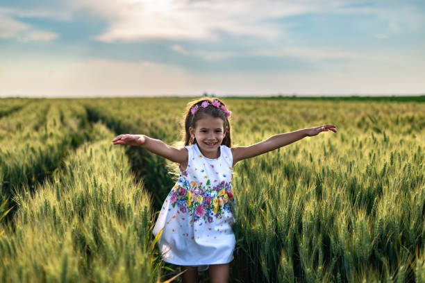 istock Happy girl enjoying nature 1373298413
