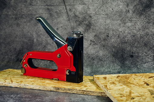 Metal furniture (industrial) stapler, close-up shot, useful tool for home