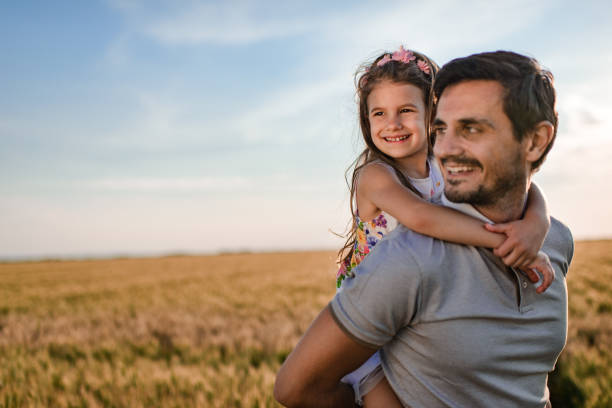 istock Father and daughter enjoying nature 1373299278