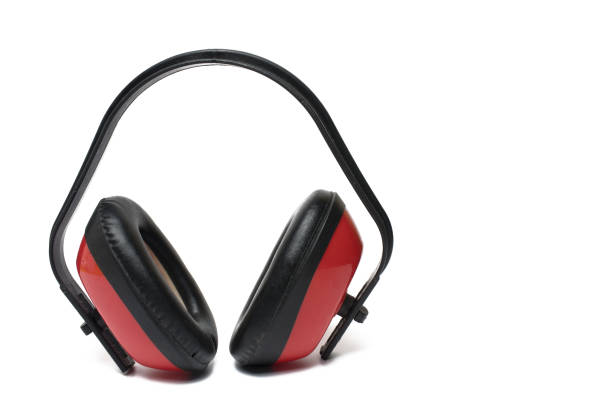 Close up of professional hearing protection with red ear capsules and black temple for work protection in noisy environment on white background earmuff