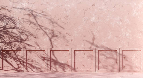 istock Premium abstract concrete texture background with palm leaves shadow on the wall 1373301208