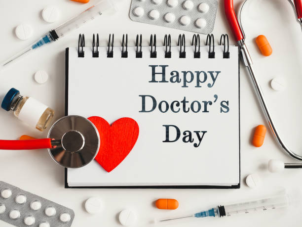 istock Happy Doctor's Day. Greeting Card. Close-up, top view 1373301480