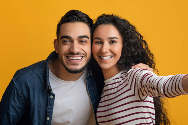 istock Cheerful Young Middle Eastern Couple Taking Selfie Together, POV Shot 1373302575