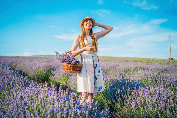 istock Happy woman in lavender field 1373302901