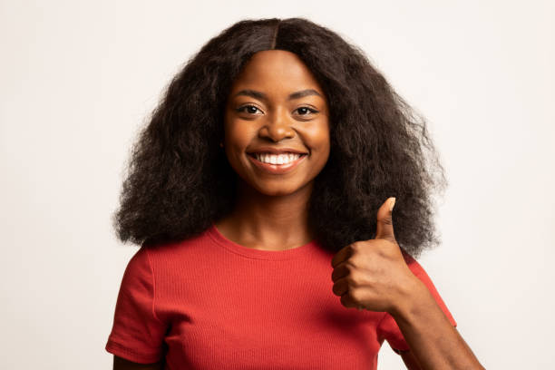 istock Nice Choice. Smiling Young Black Lady Showing Thumb Up At Camera 1373303008