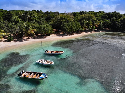 Grande-Terre island drone view in Guadeloupe. Boats and Petit Havre beach.