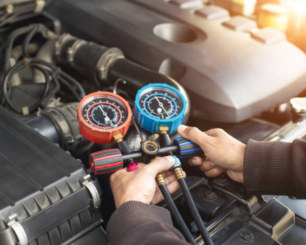istock Car air conditioner check service, leak detection, fill refrigerant. 1373304556