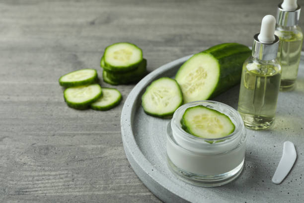 istock Cosmetics and cucumber on tray on gray textured background 1373310678