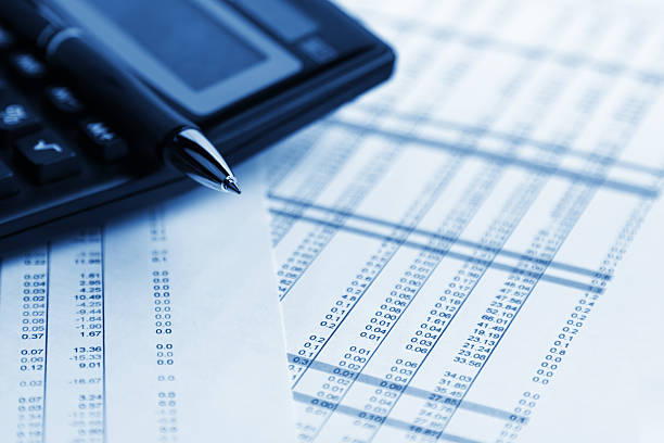istock A table of figures with a calculator resting on it 137331686