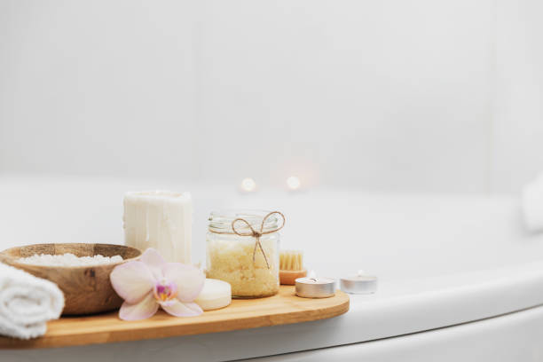 istock Hotel spa treatment or home bath procedure. Bathroom with accessories on tray 1373318686