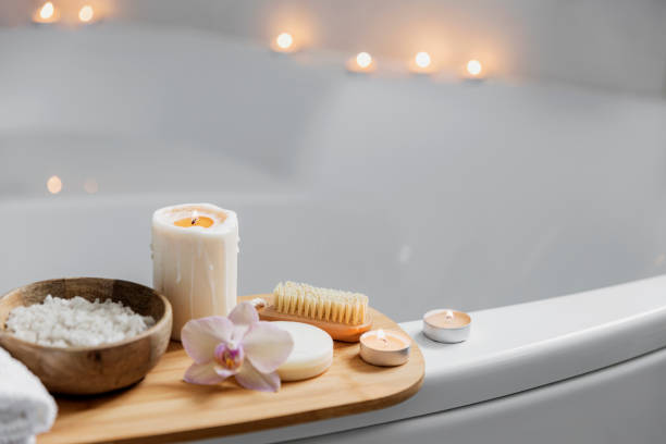 istock Hotel spa treatment or home bath procedure. Bathroom with accessories on tray 1373318691