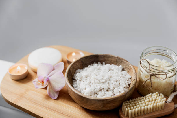 istock Hotel spa treatment or home bath procedure. Bathroom with accessories on tray 1373318694