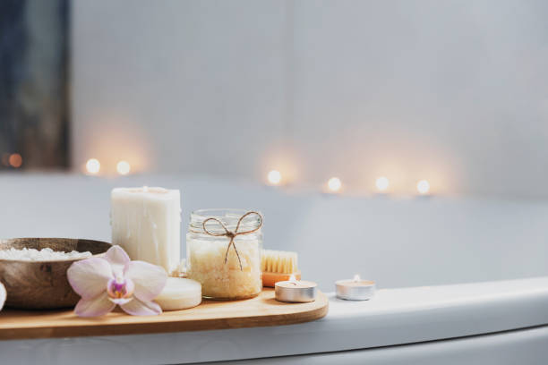 istock Hotel spa treatment or home bath procedure. Bathroom with accessories on tray 1373323478
