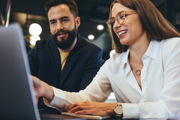 istock Young entrepreneurs using a laptop in an office 1373325052