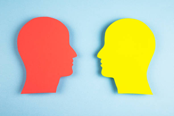 istock Human heads in paper cut style 1373326679
