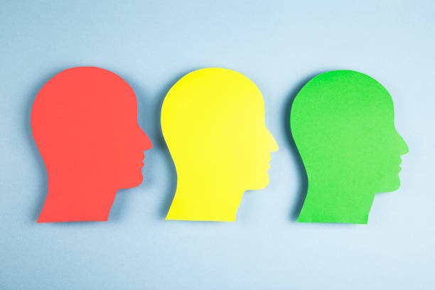 istock Human heads in paper cut style 1373327750