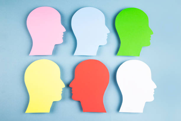 istock Human heads in paper cut style 1373328795