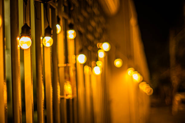 istock Decor Hanging Yellow Orange Light Lamp With Blurred lamp light Dark Night Background 1373345390