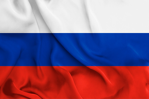 Smooth waving satin fabric colorised in\nwhite, blue and red, the colors of Russian flag.