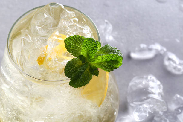 istock green tea with ice and mint stands on a gray background 1373348997