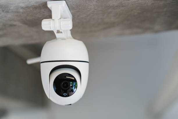 istock Security white CCTV (Closed-circuit television) camera in the office building. CCTV in building in front of elevator. 1373353812