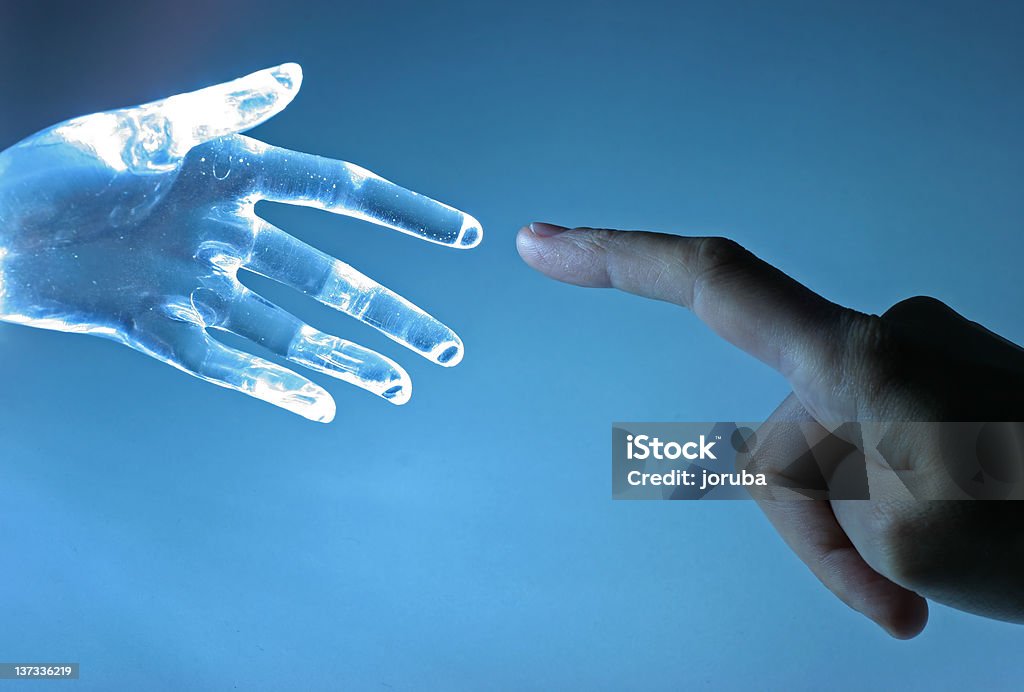 Contact Human hand touch an atrifical glass hand Intelligence Stock Photo
