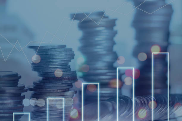 istock Double exposure of coins stack with financial graph over night cityscape background showing business growth and data analysis and planning to improve sales to reach the goals. 1373370202