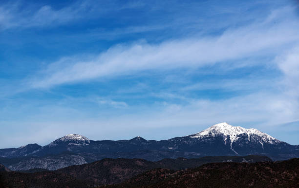 Snowy peak of mountains and blue sky in Fethiye, Turkey.
