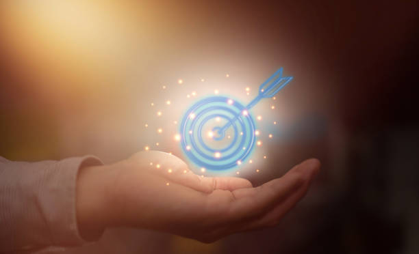 istock hand hold dart for business target success 1373387608